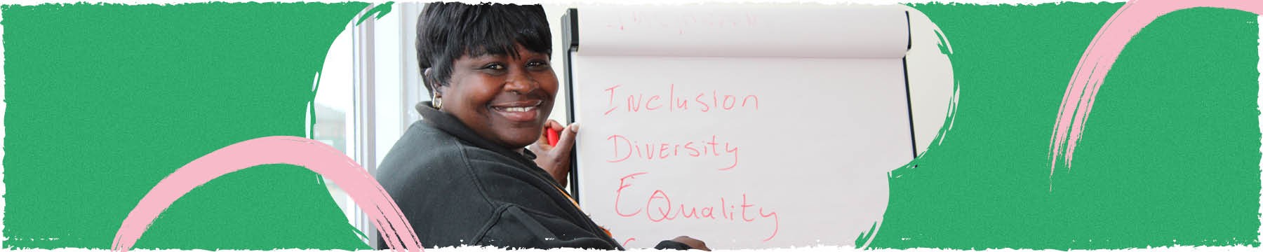 Black woman smiling in diversity and inclusion meeting.