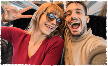 Passengers taking a selfie on the train