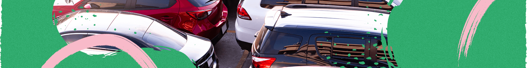 Cars parked closely together at the train station