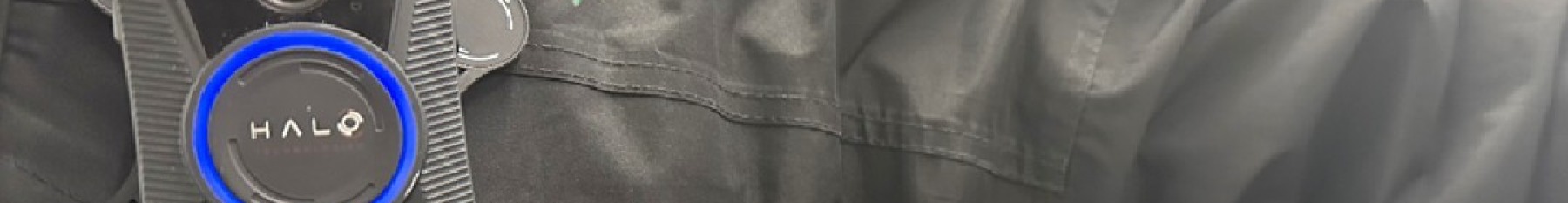 An image of a LNR colleague wearing a Body Worn Camera on a black jacket with the LNR logo. 