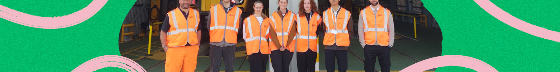graduates stood at depot with high vis