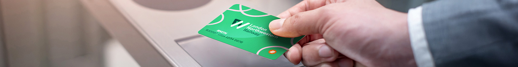 Passenger tapping into a ticket gate with a Smartcard
