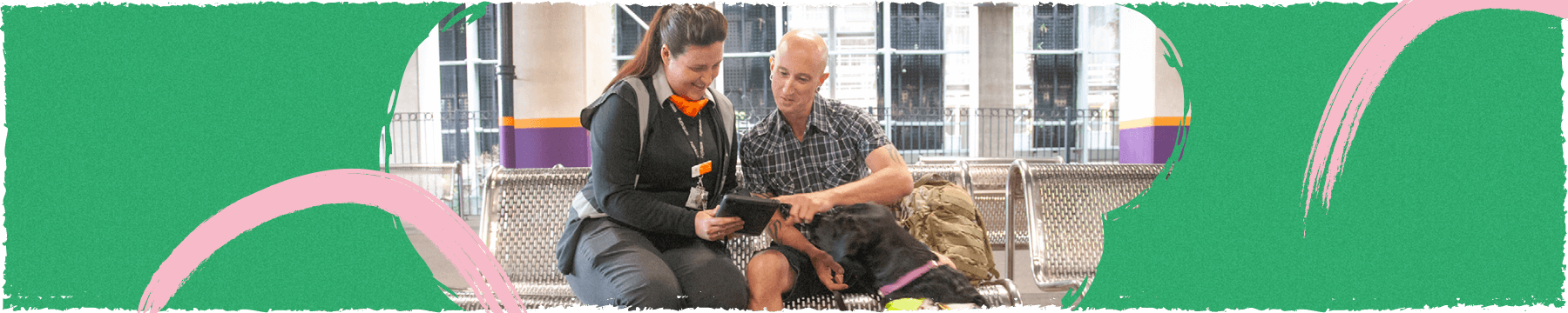 Railway staff member speaking to a member of the public