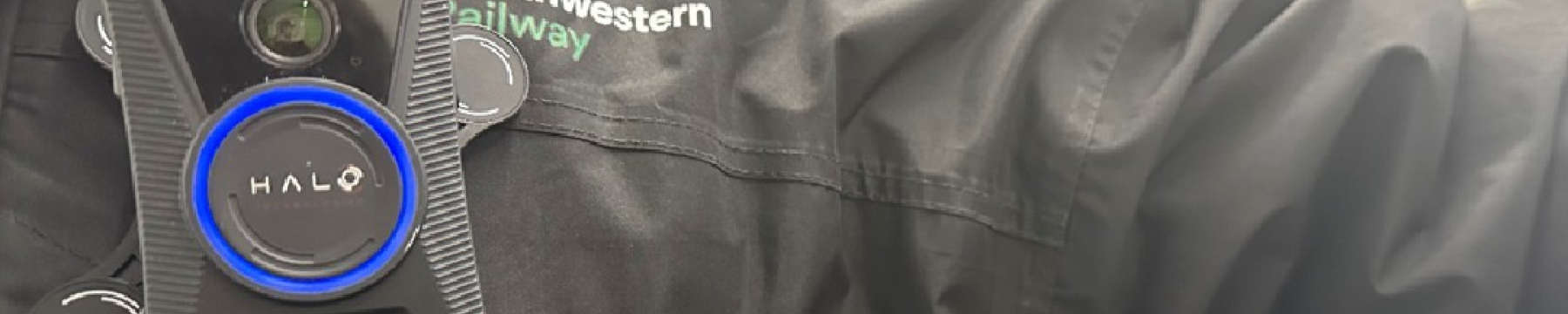 An image of a LNR colleague wearing a Body Worn Camera on a black jacket with the LNR logo 