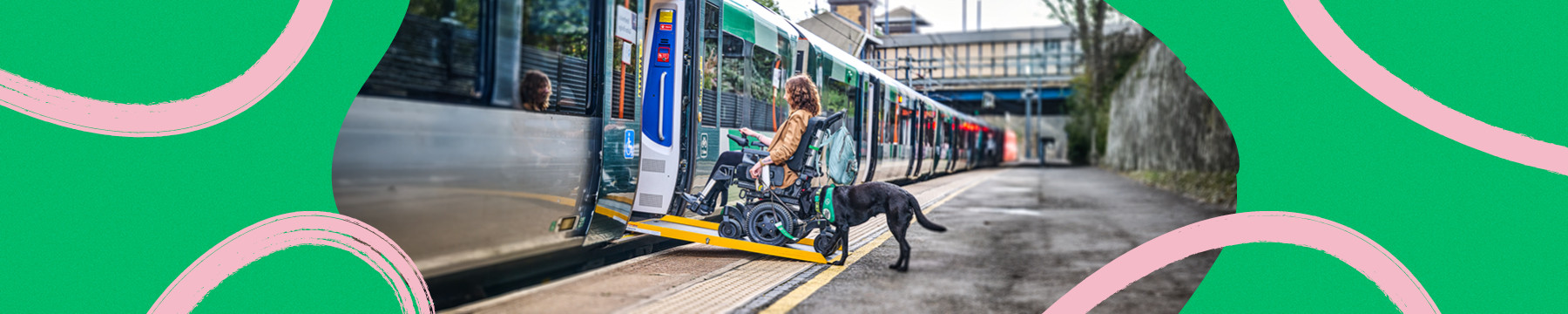 a wheelchair user boarding a train using a ramp with an assistance dog