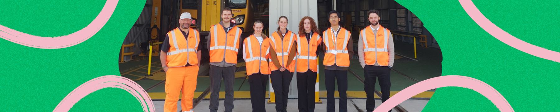 graduates stood at depot with high vis