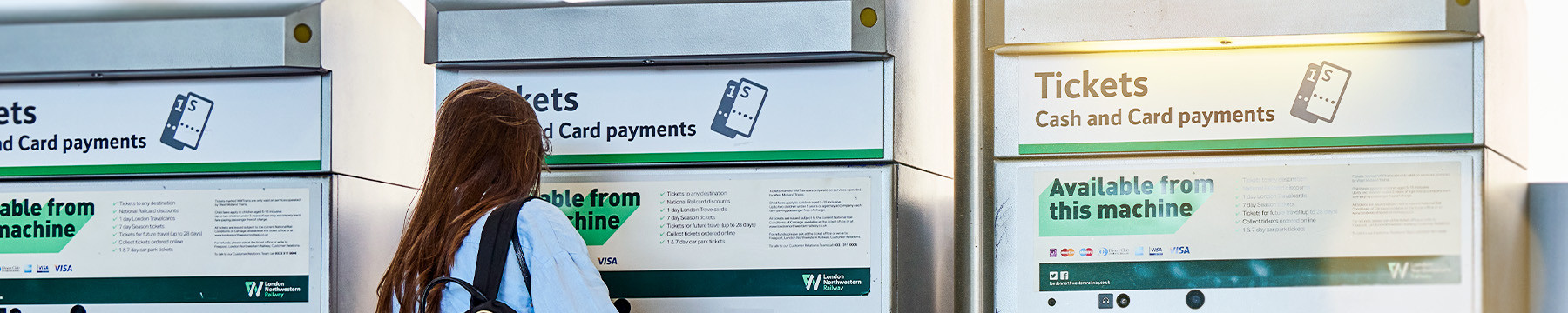 Passesnger using a ticket vending machine