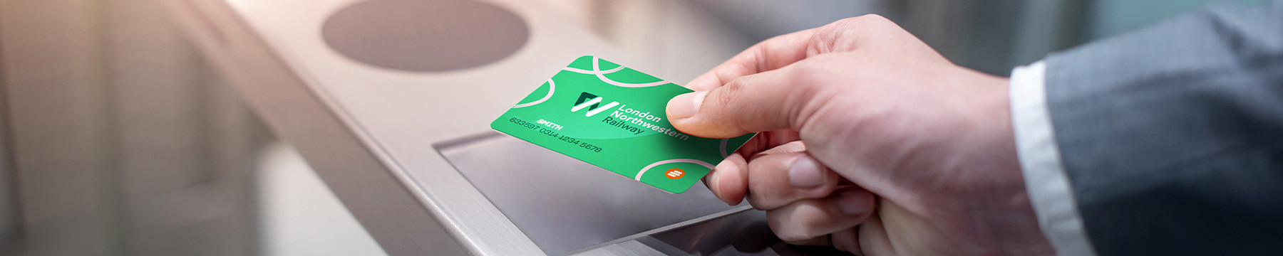 Passenger tapping into a ticket gate with a Smartcard