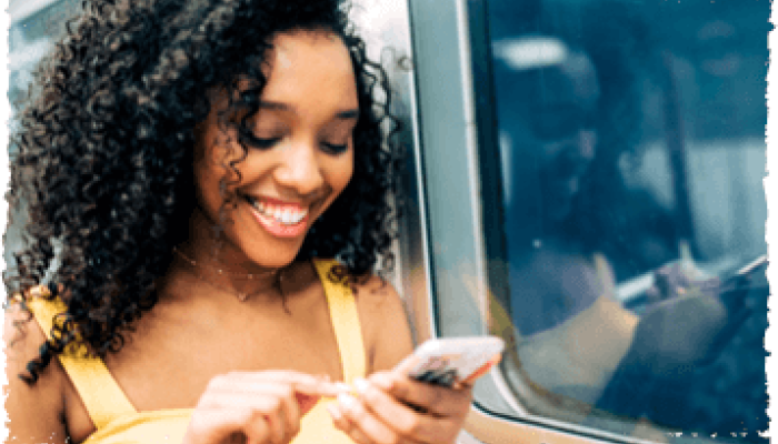 Passenger reading phone on a train