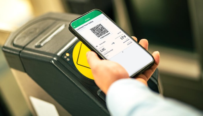 Passenger using the LNR app as a ticket on a gateline
