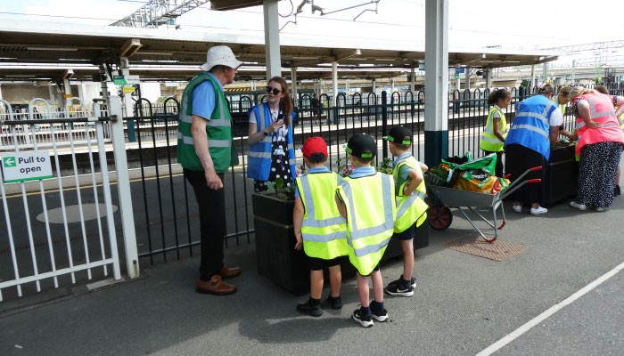 Station adopters installing new planters