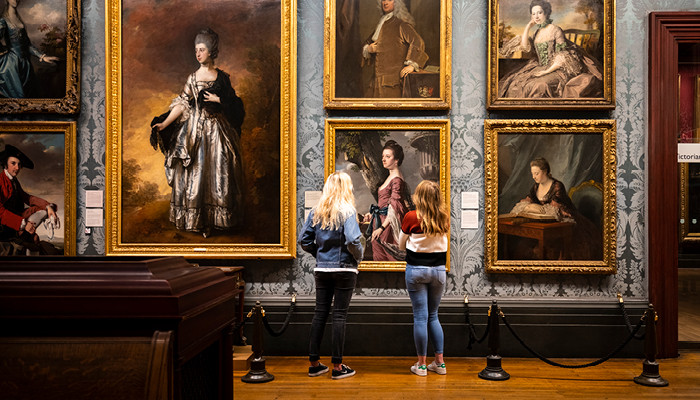 two people admiring art at a gallery