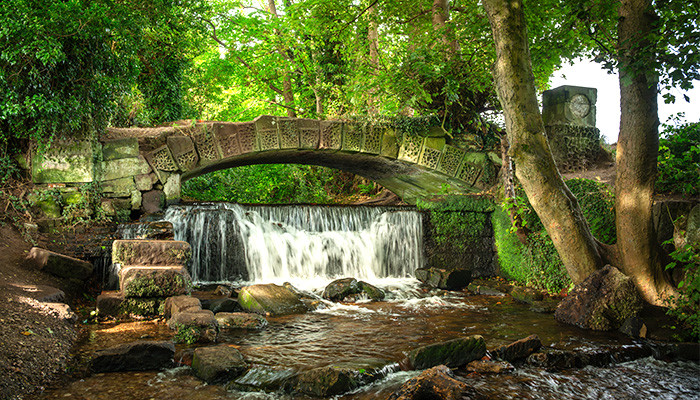 footbridge with waterfall