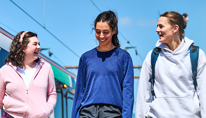Students walking on train platform