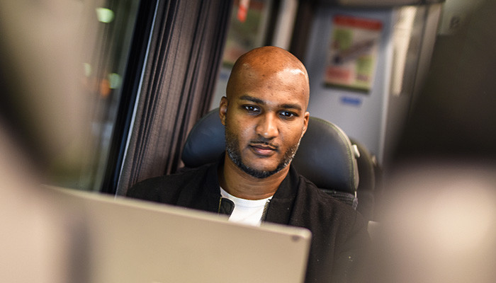 Passenger working on the train