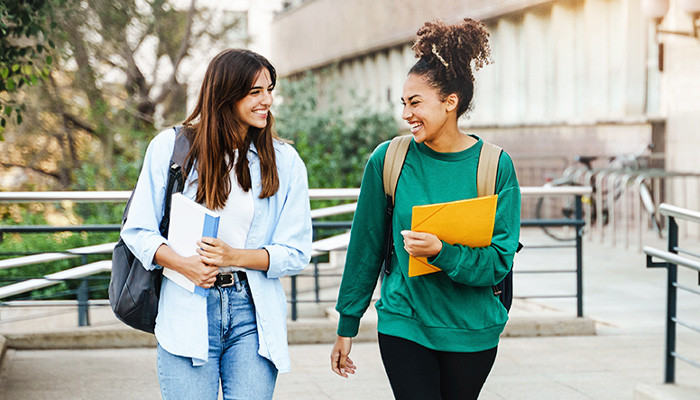 Two students walking to university