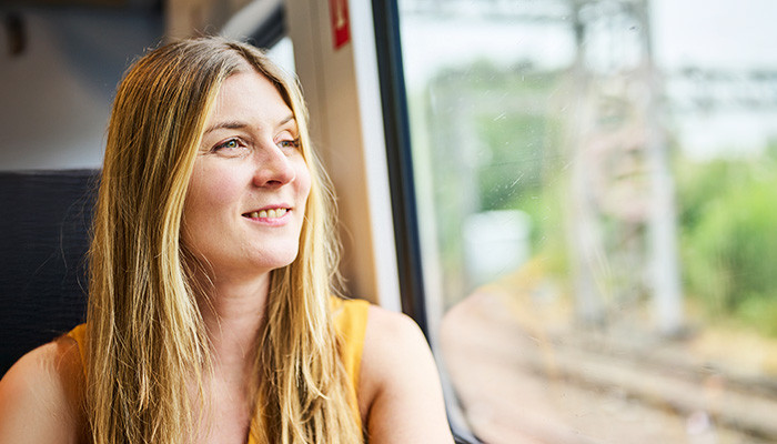 Passenger looking out the train window