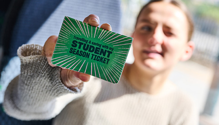 Student holding Student Season Ticket
