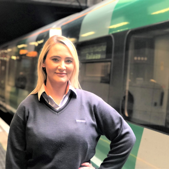 Victoria Harris next to an LNR train