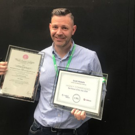 Scott Nickels with his two awards