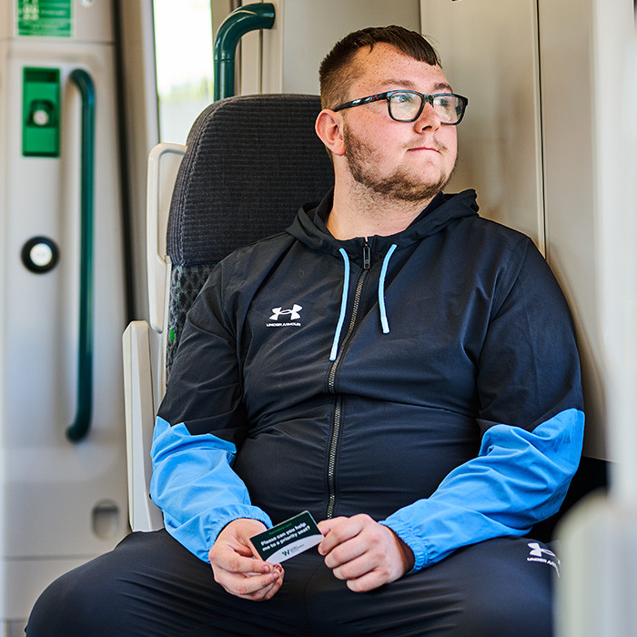 Passenger with priority seat card