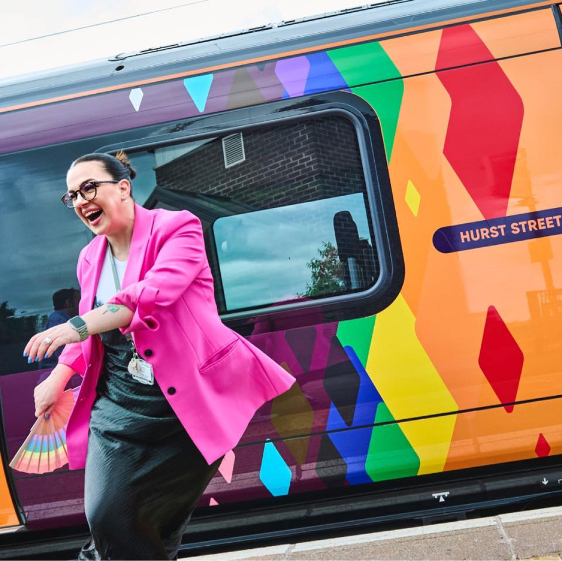 WMT colleague dancing alongside WMR 'Hurst Street' Pride Train