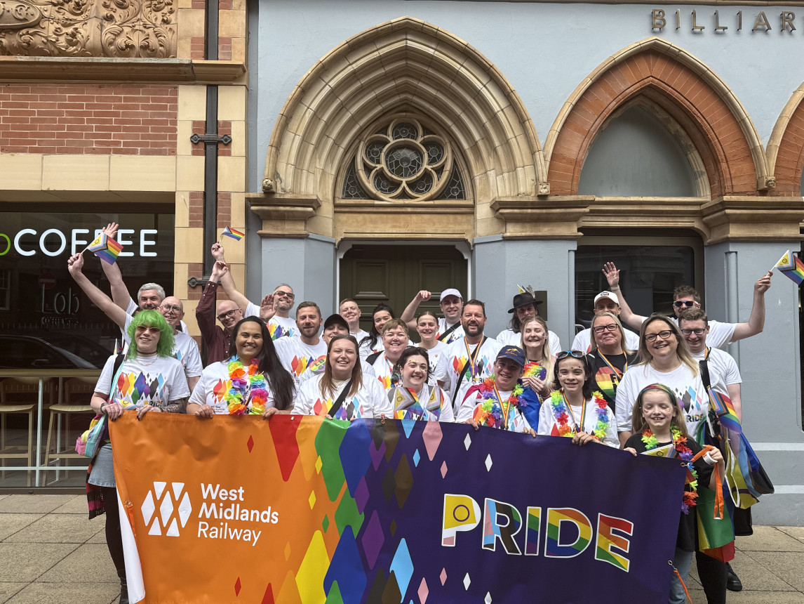 An image of colleagues celebrating Pride
