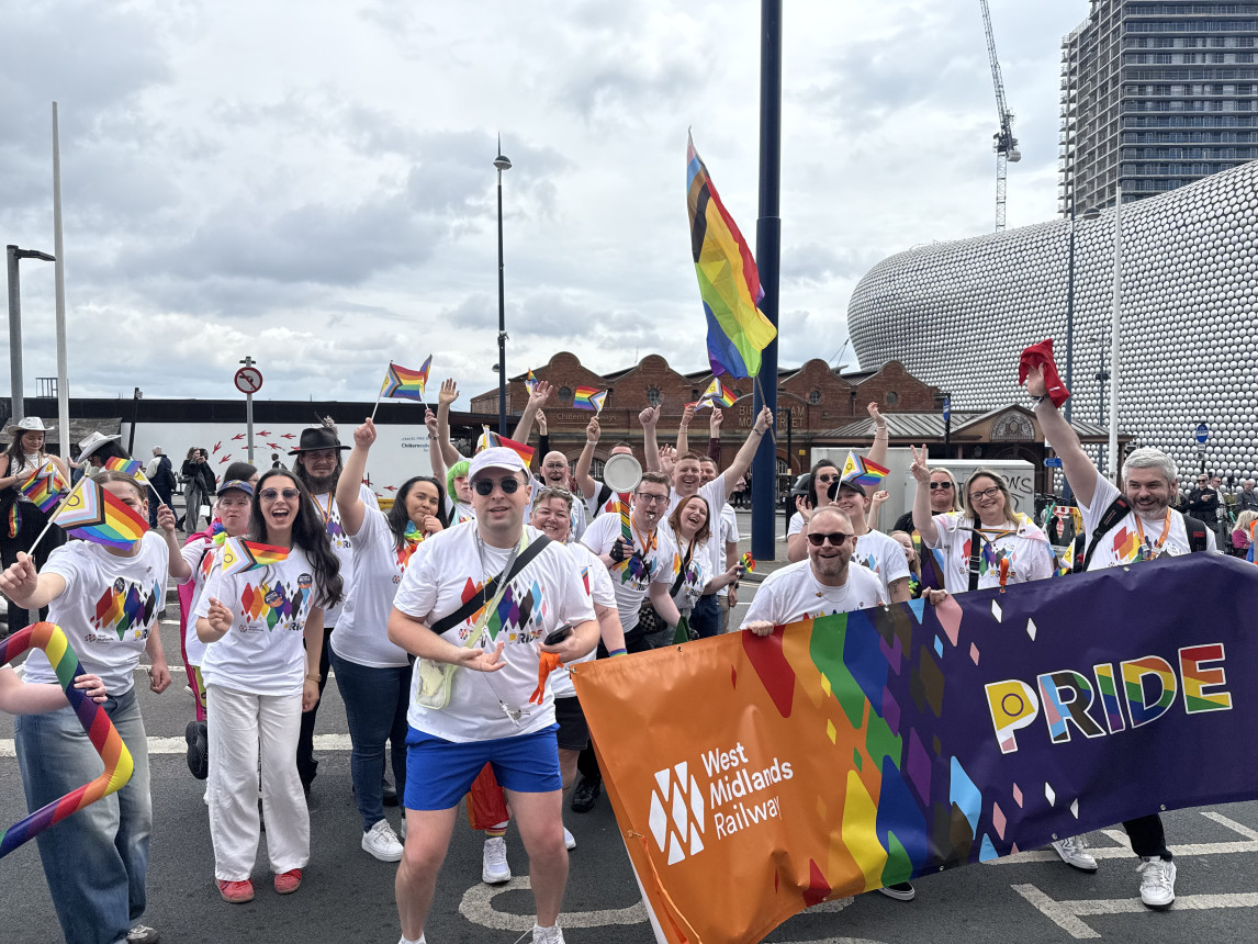 An image of colleagues celebrating Pride