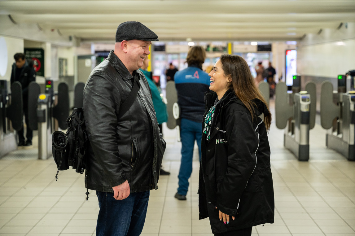 An image of a customer receiving assistance from a member of staff.