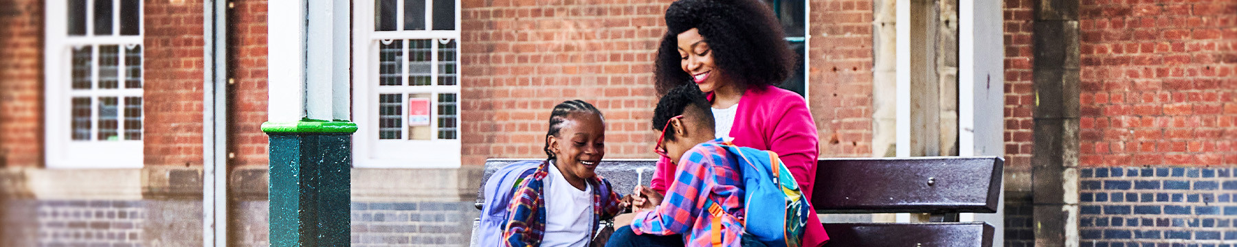 Parent with her two children at the station
