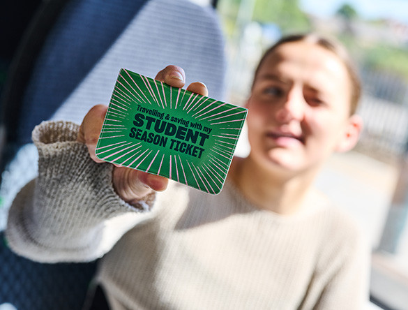 Student holding Student Season Ticket